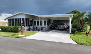 Well maintained home on corner with golf cart in Swiss Golf & Tennis