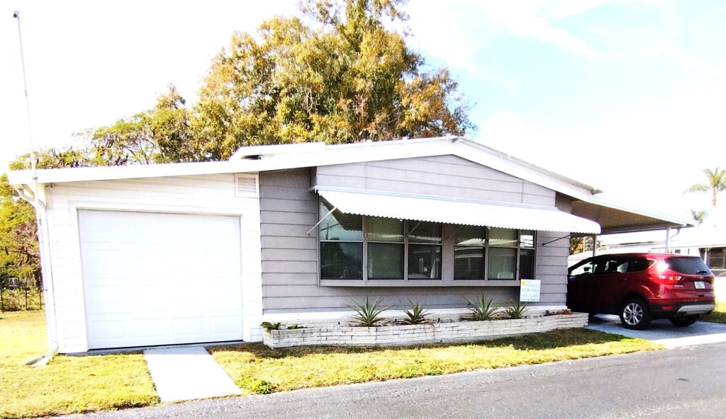 Rare Find! Oversized Lot + Garage + Golf Cart in 55+ Community