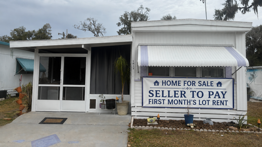 SELLER WILL PAY 1ST MONTH’S LOT RENT!   Welcome home to easy living in in the desirable Fort Meade Estates 55+ community