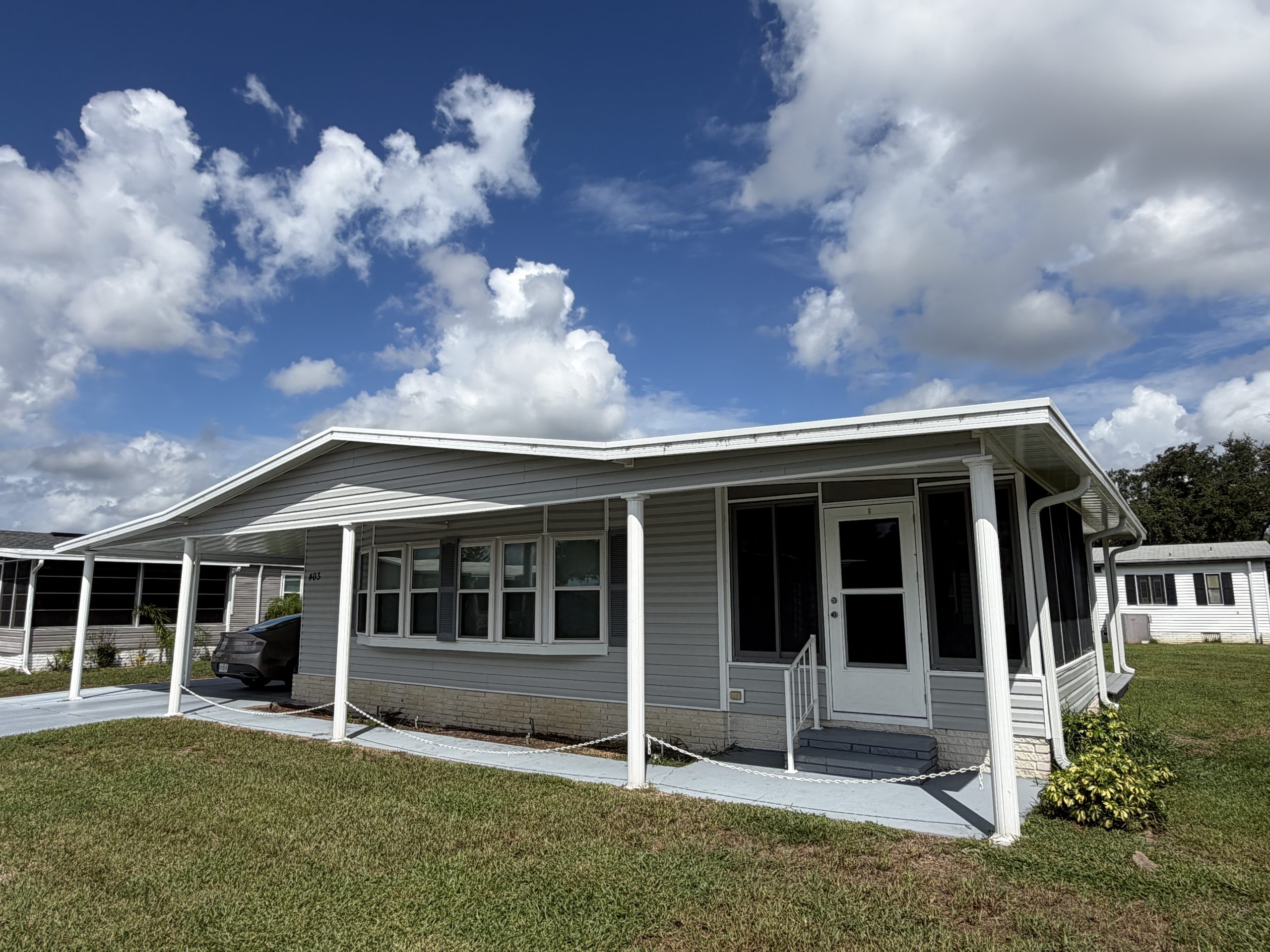 Welcome home to this inviting 2-bedroom, 2-bath double-wide in Swiss Golf & Tennis!